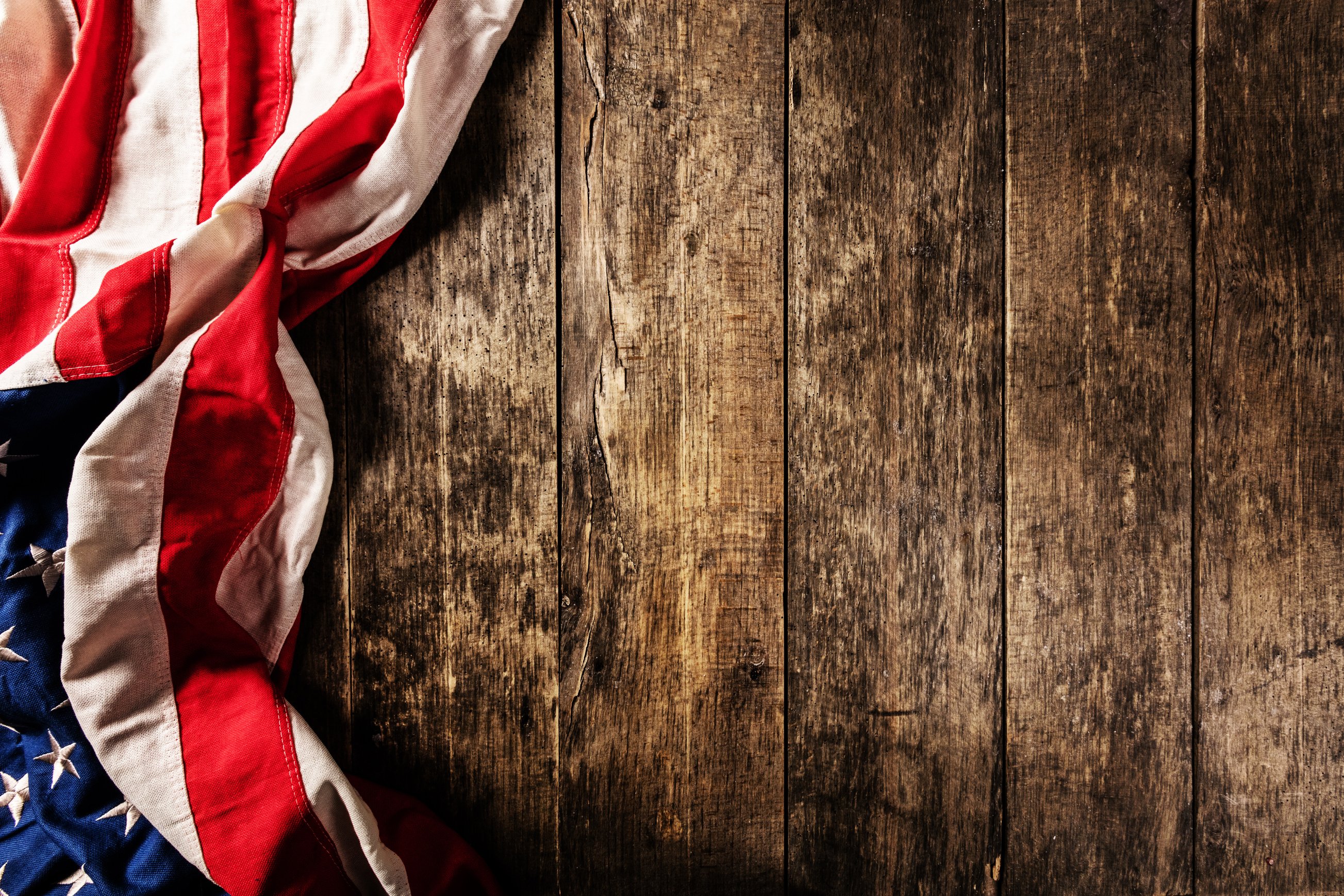 USA Flag Placed on Old Wooden Plank